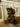 Man in brown wool cowboy hat and sunglasses on subway train, urban style.
