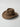 KhaanQuest Frontier Spirit Felt Western Hat – Brown wool felt cowboy hat with antique metal hardware on leather band.