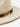 Beige hat with a decorative brown and gold band on a white background