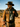 A rugged cowboy stands under soft desert sunlight, wearing a cream wool felt cowboy hat and suede jacket — the essence of western style and urban essentials.